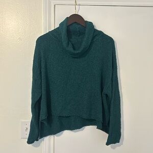Green turtleneck. Size large. Cropped. Loose neck, more of a blue green. New